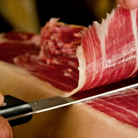 Cutting knife and vacuum packed Iberian ham